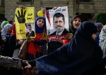 Сторонники Мухаммеда Мурси во время акции в Каире. Фото AP Photo/Eman Helal